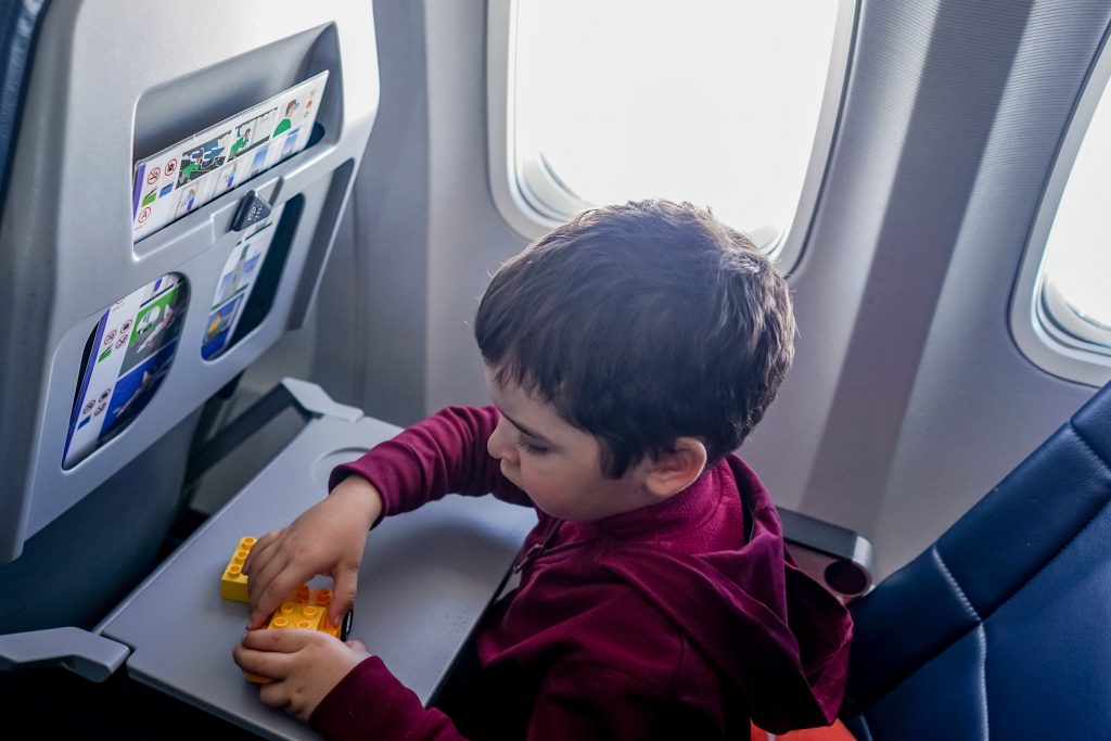 toddler flying and playing