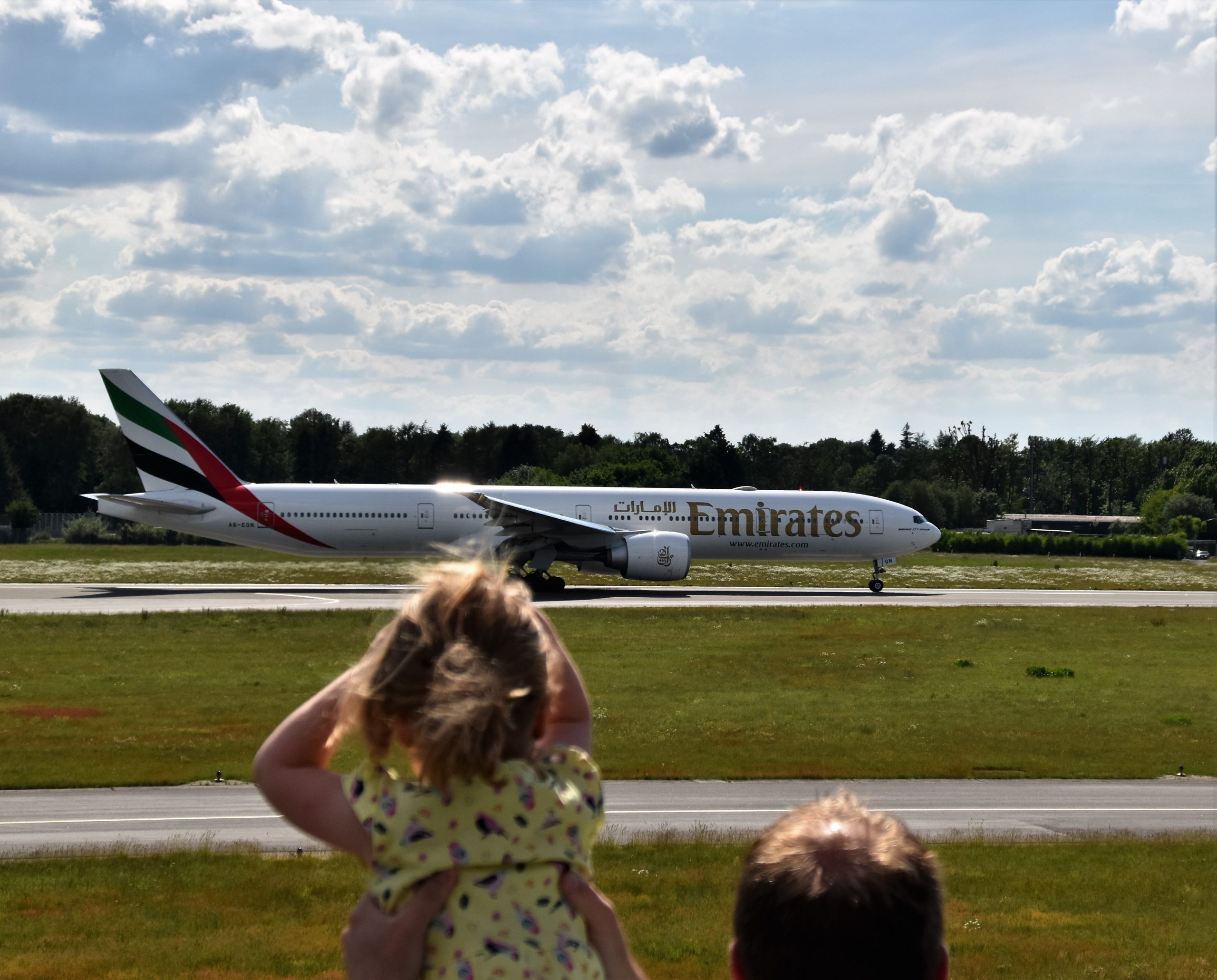 toddler looking at the airplane
