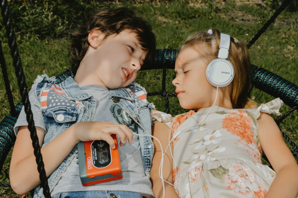 toddlers listening to music with headphones